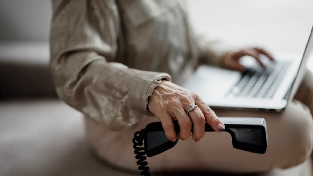 Person researching an IPTV provider while on a call