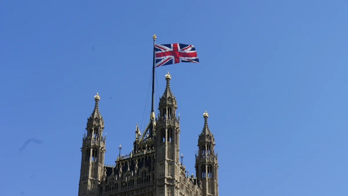 The Union Jack flying above the Victoria Tower of the Houses of Parliament in Westminster, London