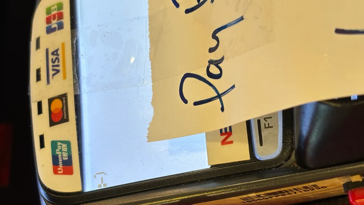 Payment terminal displaying an error, representing a warning sign