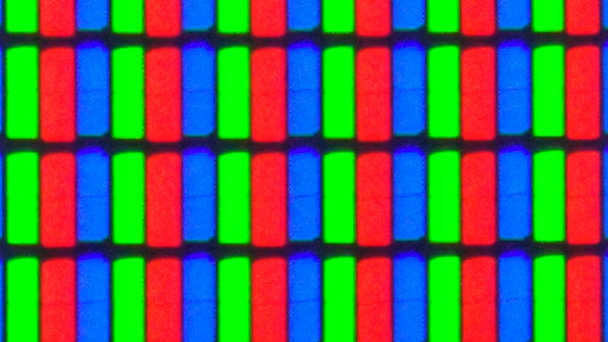 Extreme macro close-up of a full HD LED TV screen showing individual red, green, and blue subpixels
