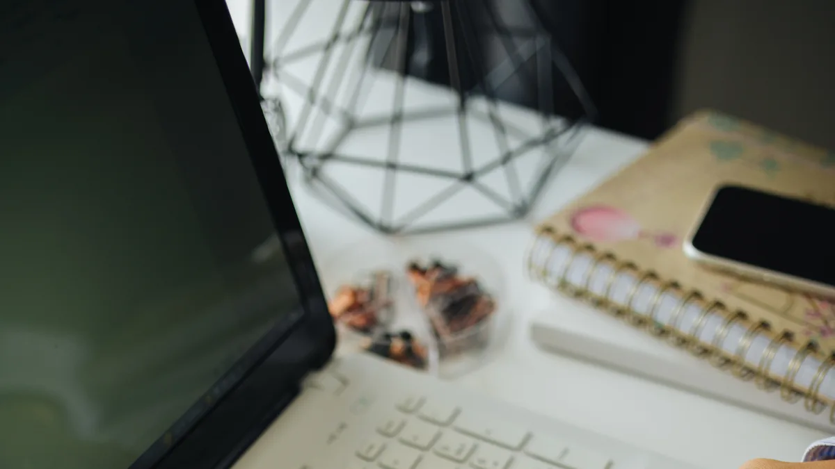 Person browsing frequently asked questions on a laptop
